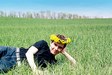 Image showing Young man in dandelion crown