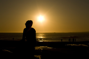 Image showing a girl looking to the sunset