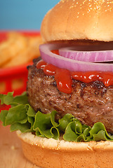 Image showing Hamburger with onions and ketchup