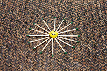Image showing Yellow smile on bamboo background