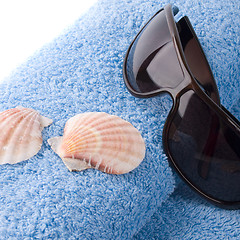 Image showing towel, shells, sunglasses