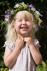Image showing laughing little girl in flowers wreath
