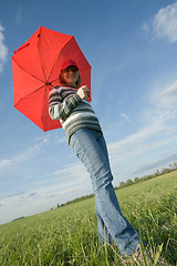 Image showing woman under red umbrella