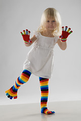 Image showing little girl in multi-coloured clothes