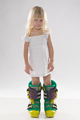 Image showing little girl in in big ski boots