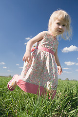 Image showing happy little girl on green meadow