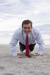 Image showing Businessman doing push-ups