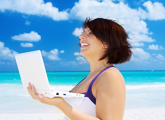 Image showing woman with laptop computer on the beach