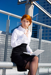 Image showing pensive businesswoman