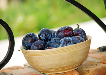 Image showing Plums wooden bowl