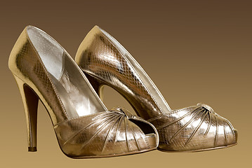 Image showing gold woman shoes