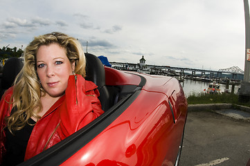 Image showing woman red sports car