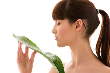 Image showing woman with green leaf