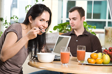 Image showing Couple eating breakfast