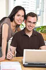 Image showing Couple paying bills by online banking