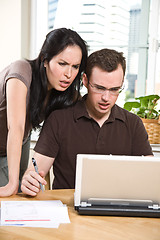 Image showing Couple paying bills by online banking