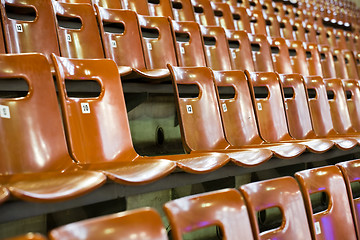 Image showing rows of seats with broken one