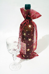 Image showing Christmas decorated bottle of wine with glass on white background