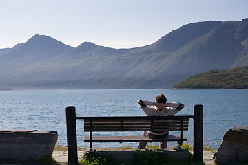 Image showing relaxed man on the bank of lake