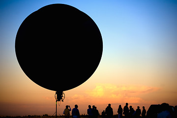 Image showing flying blimp silhouette