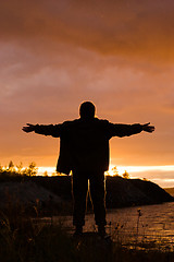 Image showing man looks at sunset