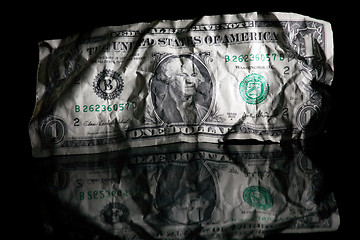 Image showing Crumpled dollar isolated on black