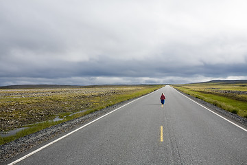 Image showing girl staying on highway