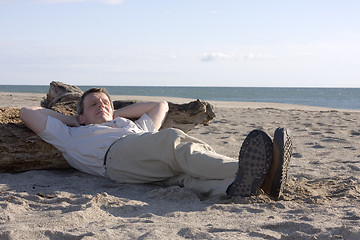 Image showing Man sleeping on beach