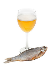 Image showing Goblet beer and dried fish