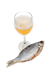 Image showing Goblet beer and dried fish