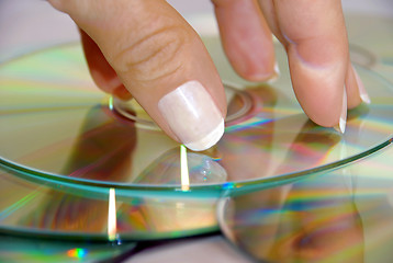 Image showing woman hand over CD