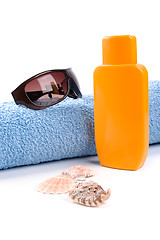 Image showing towel, sunglasses and lotion 