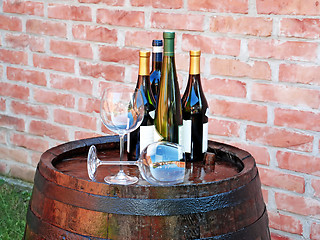 Image showing Wine over wood barrel