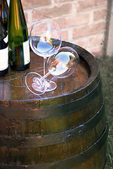 Image showing Wine over wood barrel