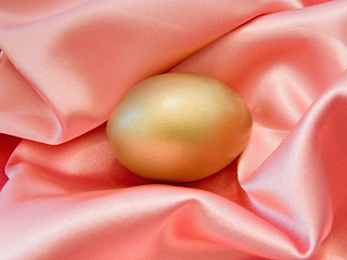 Image showing Golden egg in silk