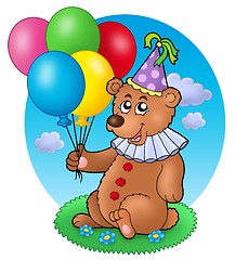 Image showing Bear clown with balloons on meadow