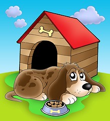 Image showing Dog resting in front of kennel