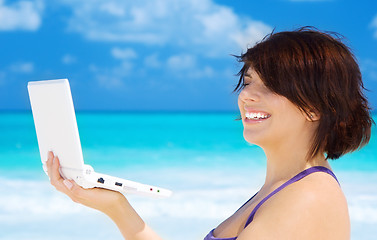 Image showing woman with laptop computer on the beach