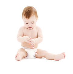 Image showing baby boy in diaper with toothbrush