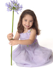 Image showing Pretty girl holding flower