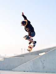 Image showing Modern teenage skater catching some air