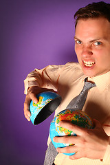 Image showing Evil businessman destroying the world