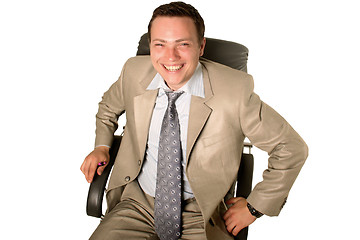 Image showing Young businessman sitting in chair 