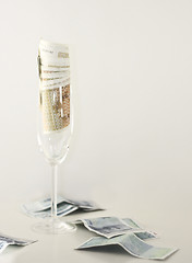 Image showing bills in champagne flute