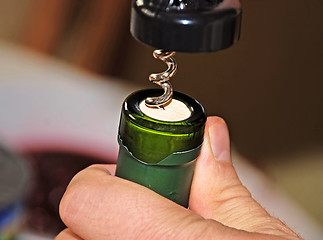 Image showing Opening wine