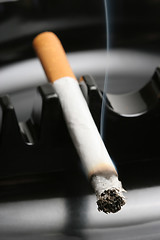 Image showing smoking cigarette in ashtray