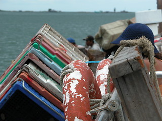 Image showing Crates and a Lifebuoy on a Boat