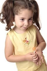 Image showing Shy toddler girl smiling