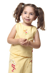 Image showing Pretty smiling little girl with ponytails