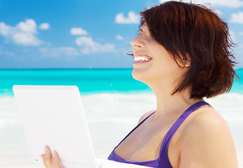 Image showing woman with laptop computer on the beach